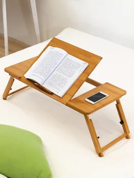 Раскладная кровать Маленький книжный столик ноутбук Ленивый студент общежития Домашняя спальня Написание Простое
